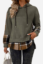 Countryside Layered Hoodie with built-in plaid hem and cuffs, relaxed tunic fit, drop shoulder design, and drawstring hood in soft velvet-touch fabric.