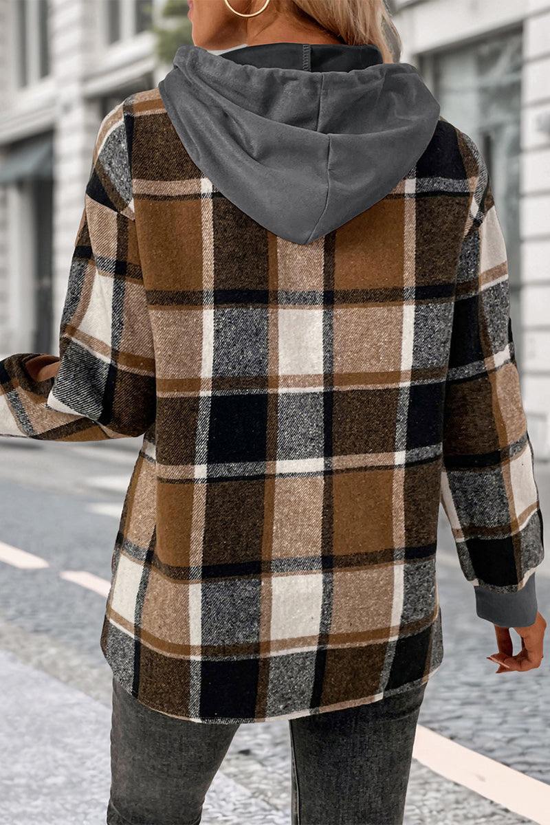 Back view of woman wearing Countryside Layered Hoodie with brown plaid design and gray hood outdoors