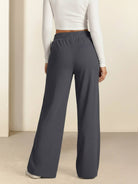 Soft knit wide-leg pants with elastic drawstring waist and functional pockets in breathable fabric
