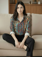 floral button-down shirt with long roll-up sleeves and hip-length hem for versatile wear