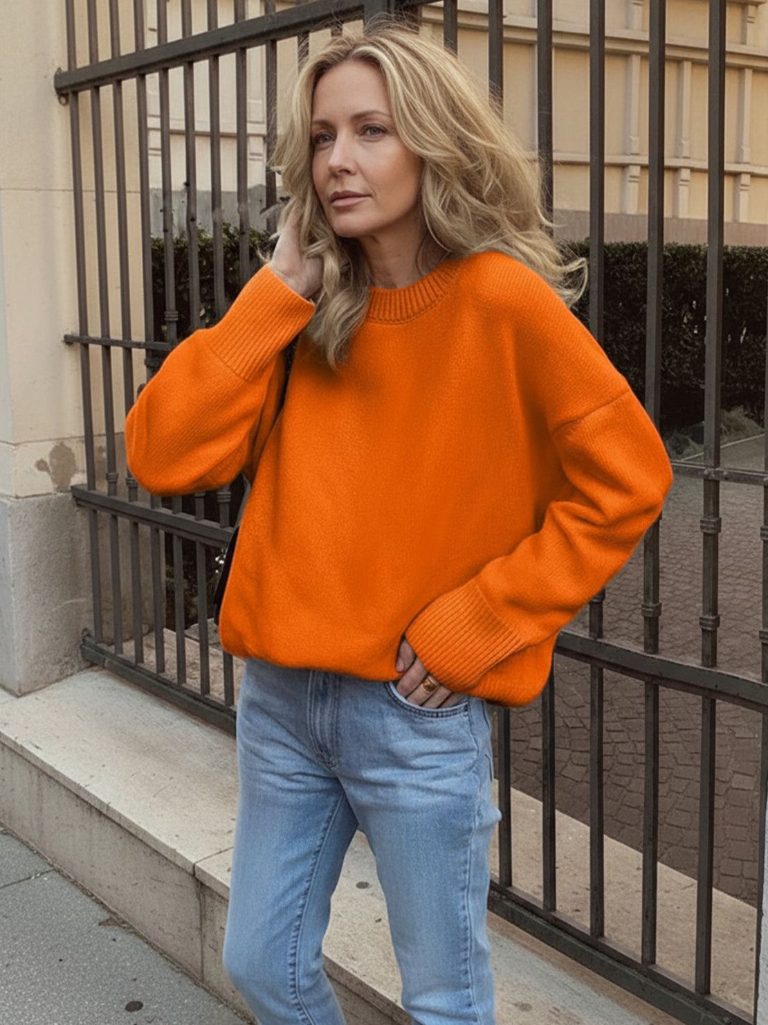 oversized crew neck knit sweater with drop-shoulder sleeves and ribbed cuffs in neutral color