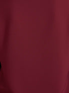 White pleated V-neck long-sleeve blouse with button cuffs and relaxed fit