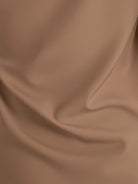 White pleated V-neck long-sleeve blouse with button cuffs and relaxed fit