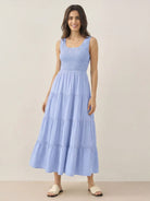 Smocked sleeveless maxi dress with tiered skirt and scoop neckline