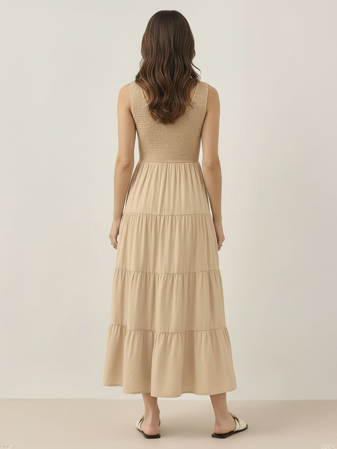 Smocked sleeveless maxi dress with tiered skirt and side pockets in lightweight polyester fabric