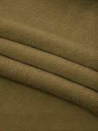 Oversized cable-knit crewneck sweater with dropped shoulders and ribbed trim in thick plush fabric