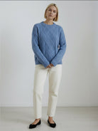 Oversized cable-knit crewneck sweater with dropped shoulders and ribbed trim in thick plush fabric