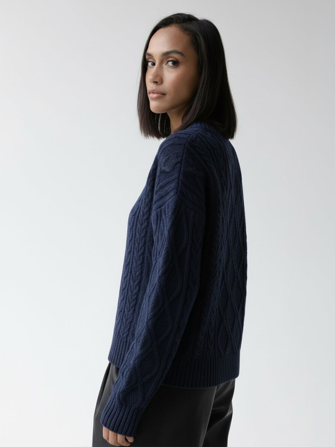 Oversized cable-knit crewneck sweater with dropped shoulders and ribbed trim in thick plush fabric