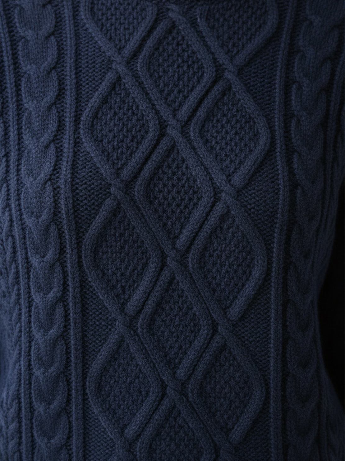 Oversized cable-knit crewneck sweater with dropped shoulders and diamond rope pattern