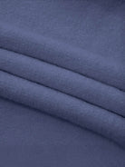 Oversized cable-knit crewneck sweater with dropped shoulders and ribbed trim