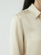 silk-finish button front shirt with traditional collar and curved hem in smooth fabric