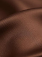 Silk-finish button front shirt with relaxed fit and smooth polyester fabric