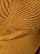 Slim fit asymmetric wrap ribbed knit top with diagonal button closure and flared cuffs