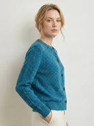 Marled knit merino wool cardigan with dark buttons and ribbed cuffs
