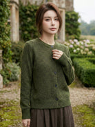 Marled knit merino wool cardigan with button front and ribbed cuffs, cozy and breathable layering sweater