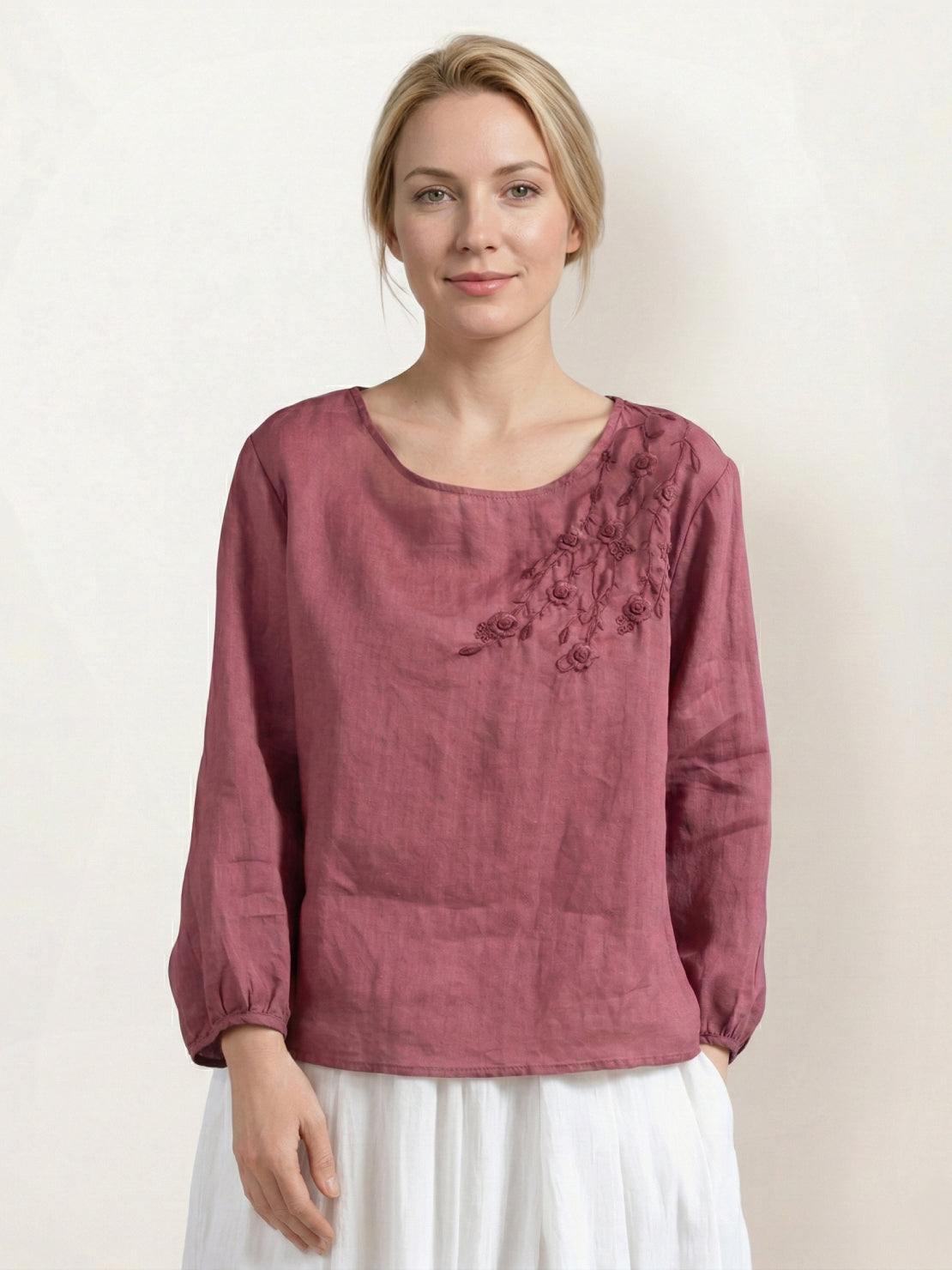 Cotton-linen embroidered blouse with relaxed boxy fit, balloon sleeves, and tonal floral embroidery on shoulder