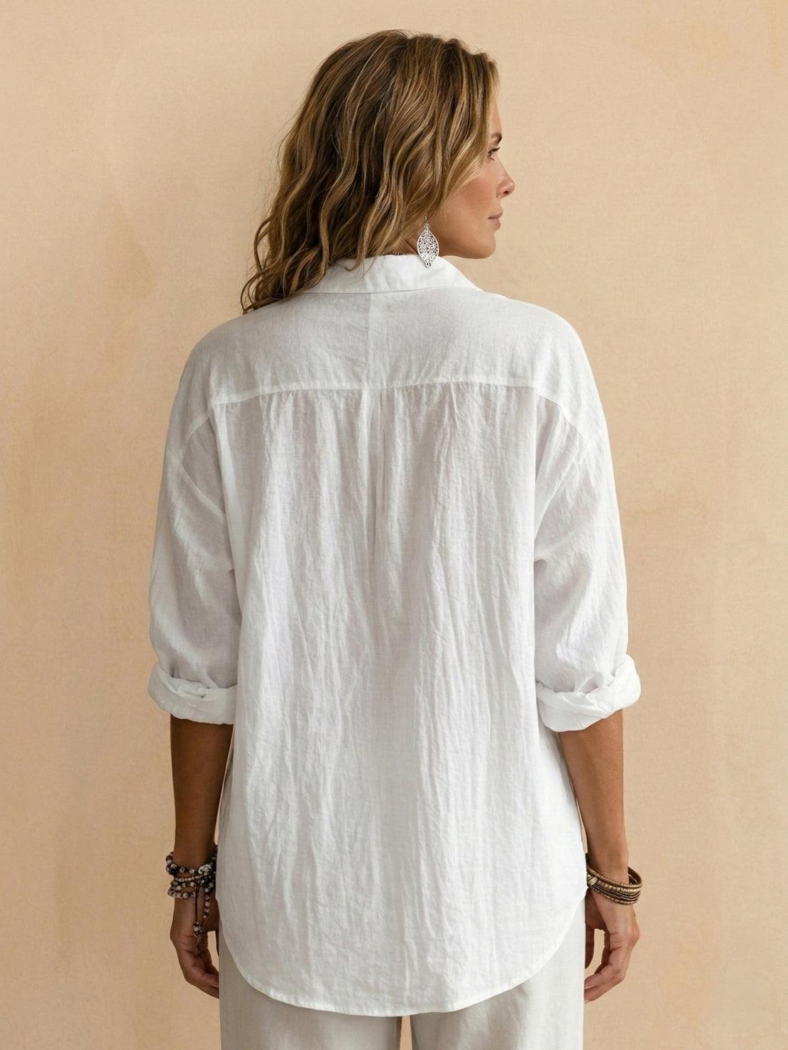 Lightweight 100% cotton popover blouse with relaxed fit, classic collar, and curved hem.