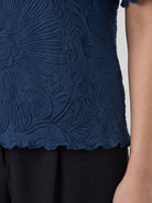 Floral Jacquard Pleated Top with 3D floral texture and flutter sleeves in relaxed A-line silhouette