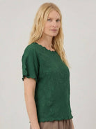 Floral Jacquard Pleated Top with 3D floral texture and flutter sleeves in relaxed A-line silhouette