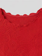 Floral Jacquard Pleated Top with 3D floral texture, flutter sleeves, and relaxed A-line silhouette