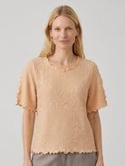 Floral jacquard pleated top with 3D texture, flutter sleeves, and relaxed A-line silhouette