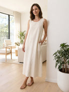 100% cotton linen sleeveless maxi dress with round neckline and flowing ankle-length silhouette