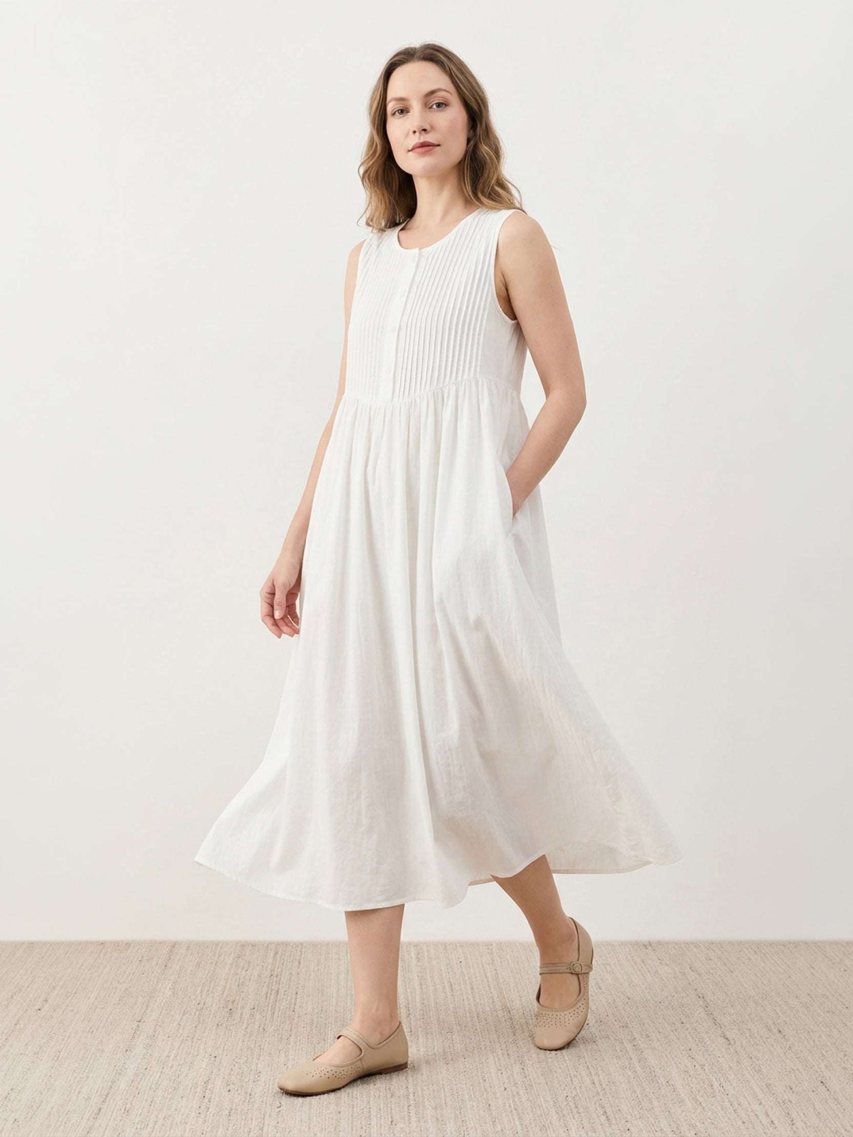 Sleeveless cotton linen pleated midi dress with pintuck bodice and full A-line skirt