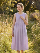 Sleeveless cotton linen pleated midi dress with pintuck bodice and full A-line calf-length skirt