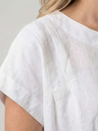 100% linen boxy cap-sleeve top with round neck and hip-length hem