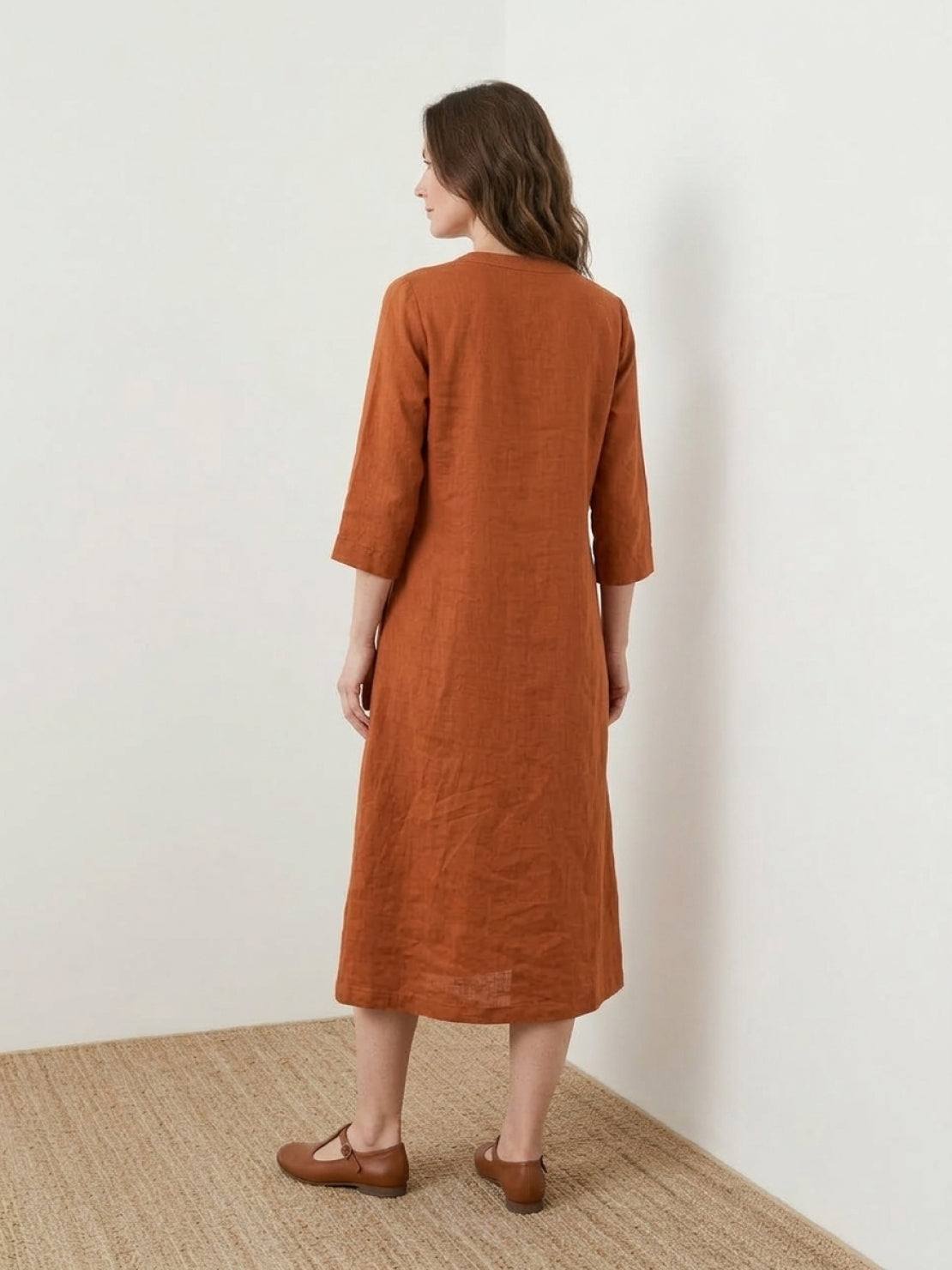 Relaxed cotton linen dress with pintuck pleats, 3/4 sleeves, side slits, and breathable fabric