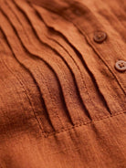 Relaxed A-line cotton linen dress with pintuck pleats, 3/4 sleeves, side slits, and breathable fabric.