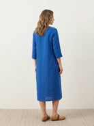 Relaxed A-line cotton linen dress with pintuck pleats, 3/4 sleeves, side slits, and breathable fabric