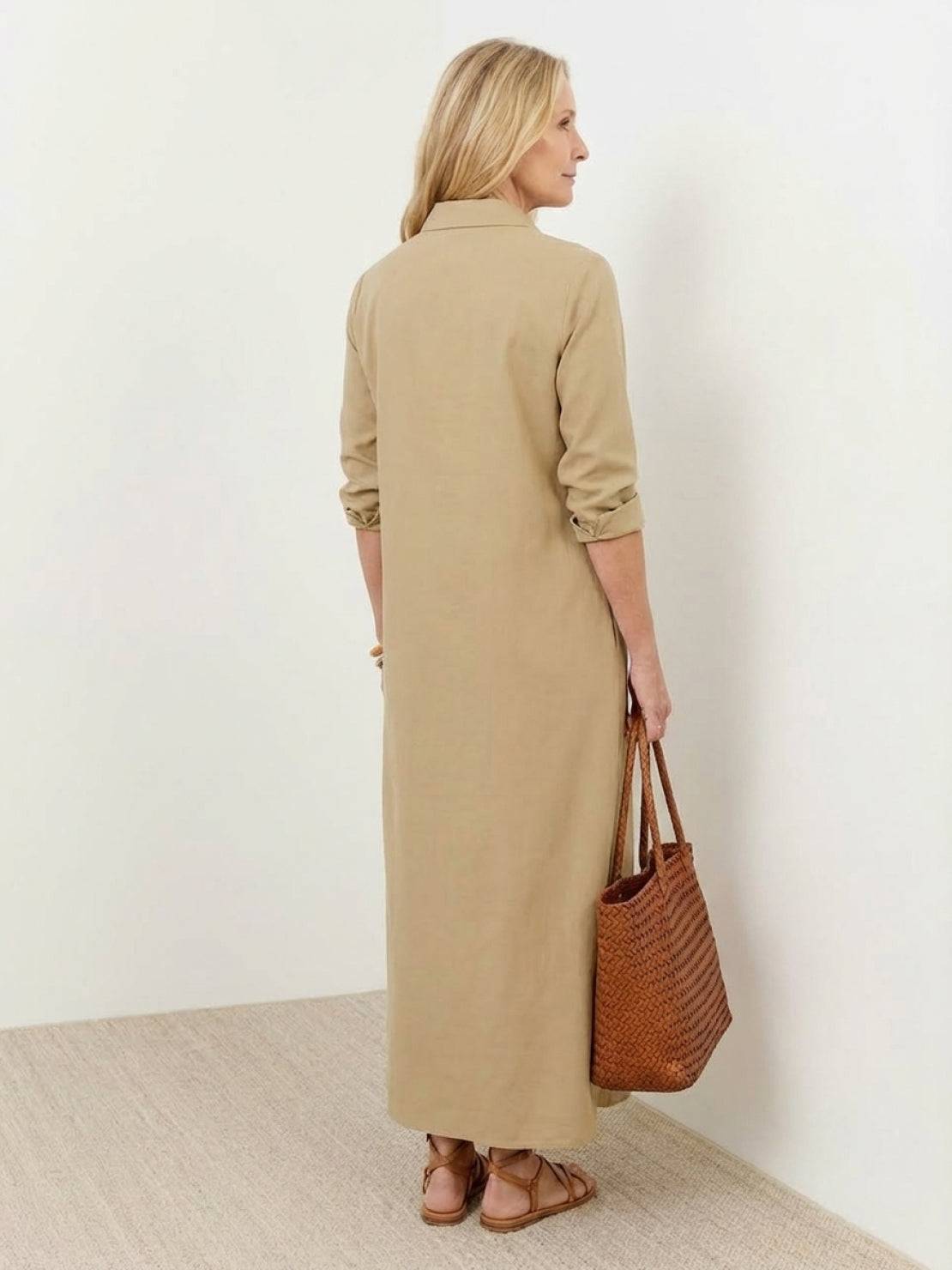 Wrinkle-free maxi button-down dress with point collar, chest pockets, and side slits for movement