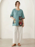 Oversized cotton linen floral shirt with elbow-length sleeves and botanical panel