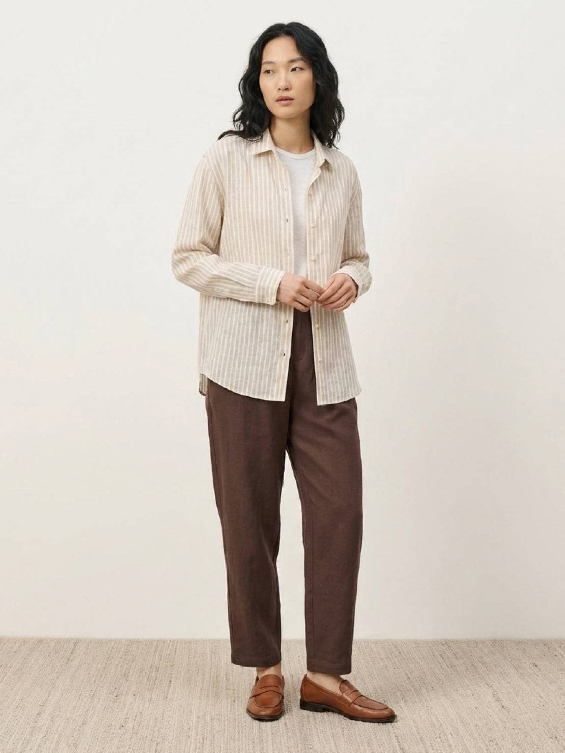 100% linen pinstripe shirt with loose fit, drop shoulders, and long sleeves with button cuffs