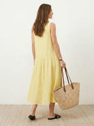 Cotton-linen summer midi dress with tiered skirt and relaxed drop-waist silhouette in light fabric