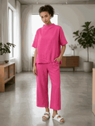 Women wearing cotton-blend capelet lounge set with cape-style top and wide-leg pants in various colors