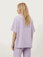 Two-piece cotton-blend capelet lounge set with batwing sleeves and wide-leg pants in multiple colors