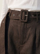 White 100% linen belted shorts with high-rise waist and relaxed wide-leg fit for summer comfort