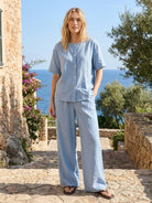 100% cotton two-piece set with button-front top and wide-leg pants in soft solid colors