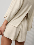 Light blue linen blend lounge set with fitted cropped top and elastic waistband shorts for comfortable casual wear