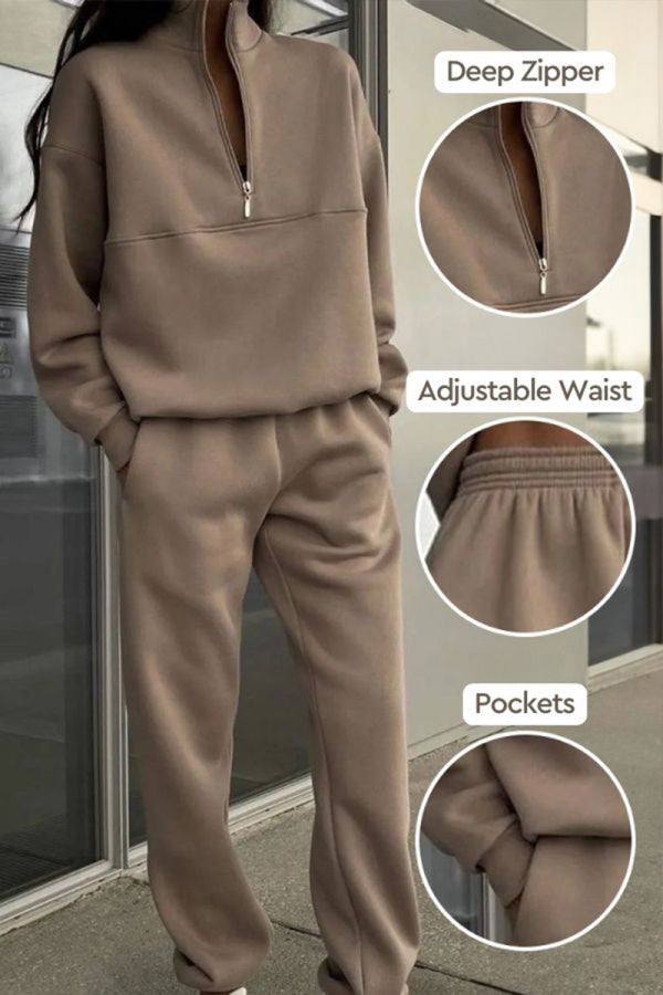 Woman wearing a comfortable cotton-blended two-piece tracksuit with high collar and deep zipper in a monochrome relaxed fit