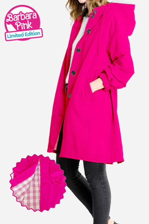 Bright pink water-resistant windbreaker with oversized fit and hood, featuring button closure and pockets.