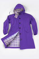 Purple water resistant oversized windbreaker with hood and plaid lining, button closure, and front pockets.