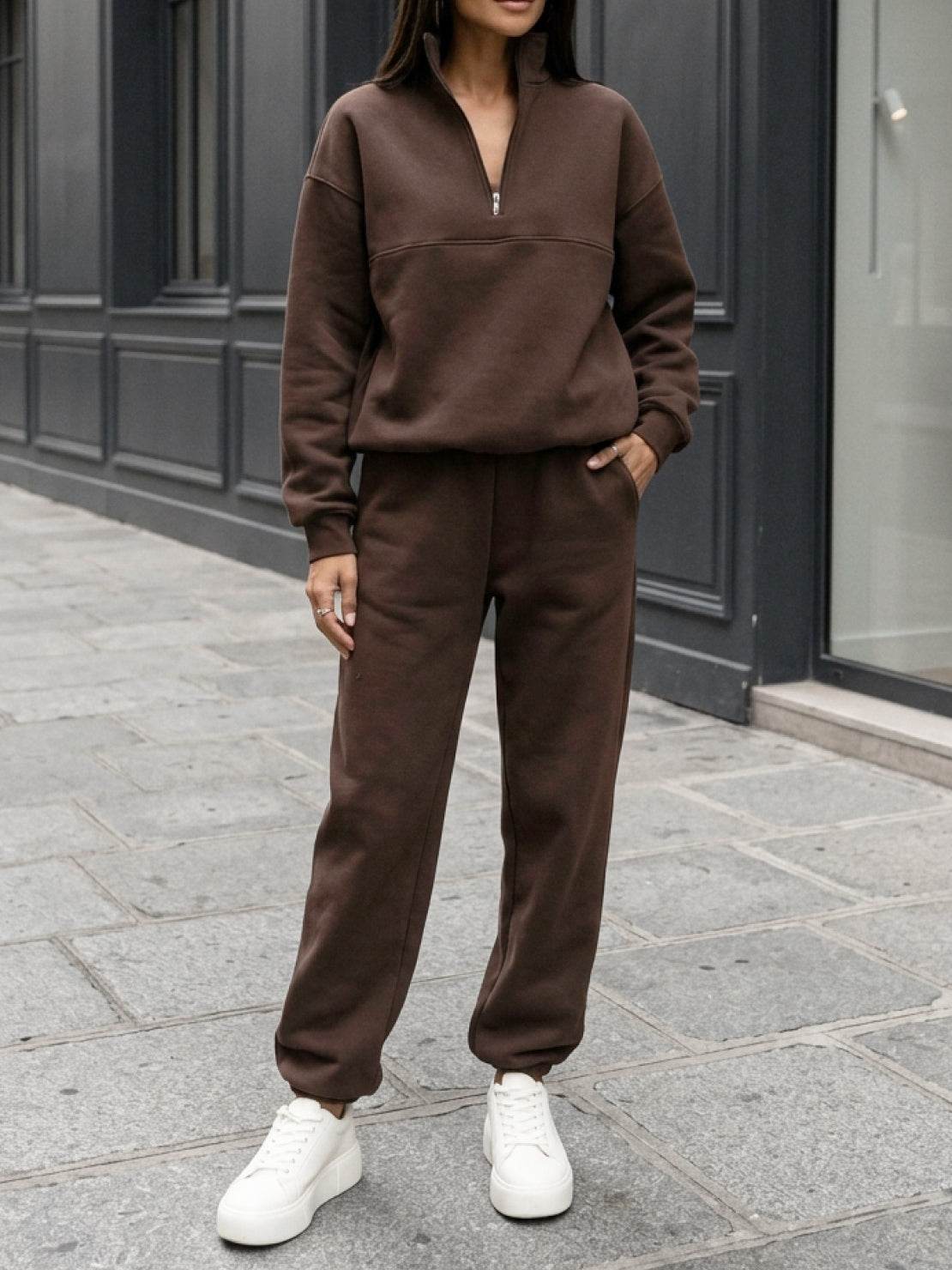 Cotton-blended two-piece tracksuit with high collar, zip front, and relaxed fit pants