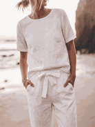 Cotton-linen set with relaxed short-sleeve top and straight-leg pants in breathable monochrome fabric
