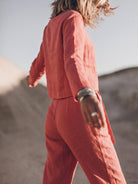 Woman wearing relaxed cotton-linen monochrome capsule outfit with longline top and wide-leg pants