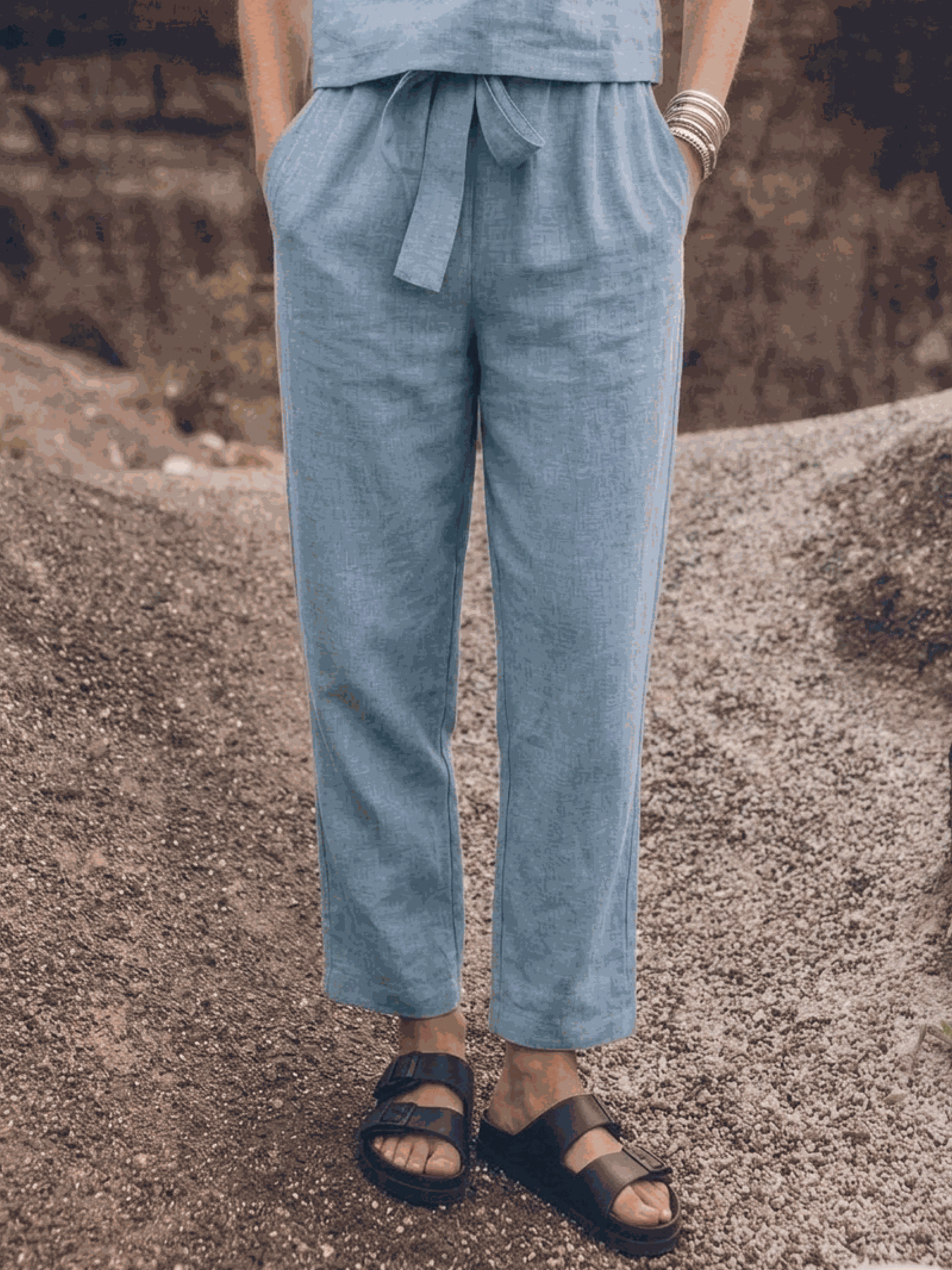 woman wearing relaxed cotton-linen set with short-sleeve top and straight-leg pants in neutral monochrome tone