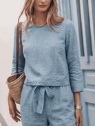 woman wearing relaxed cotton-linen set with short sleeves and straight-leg pants in soft textured fabric