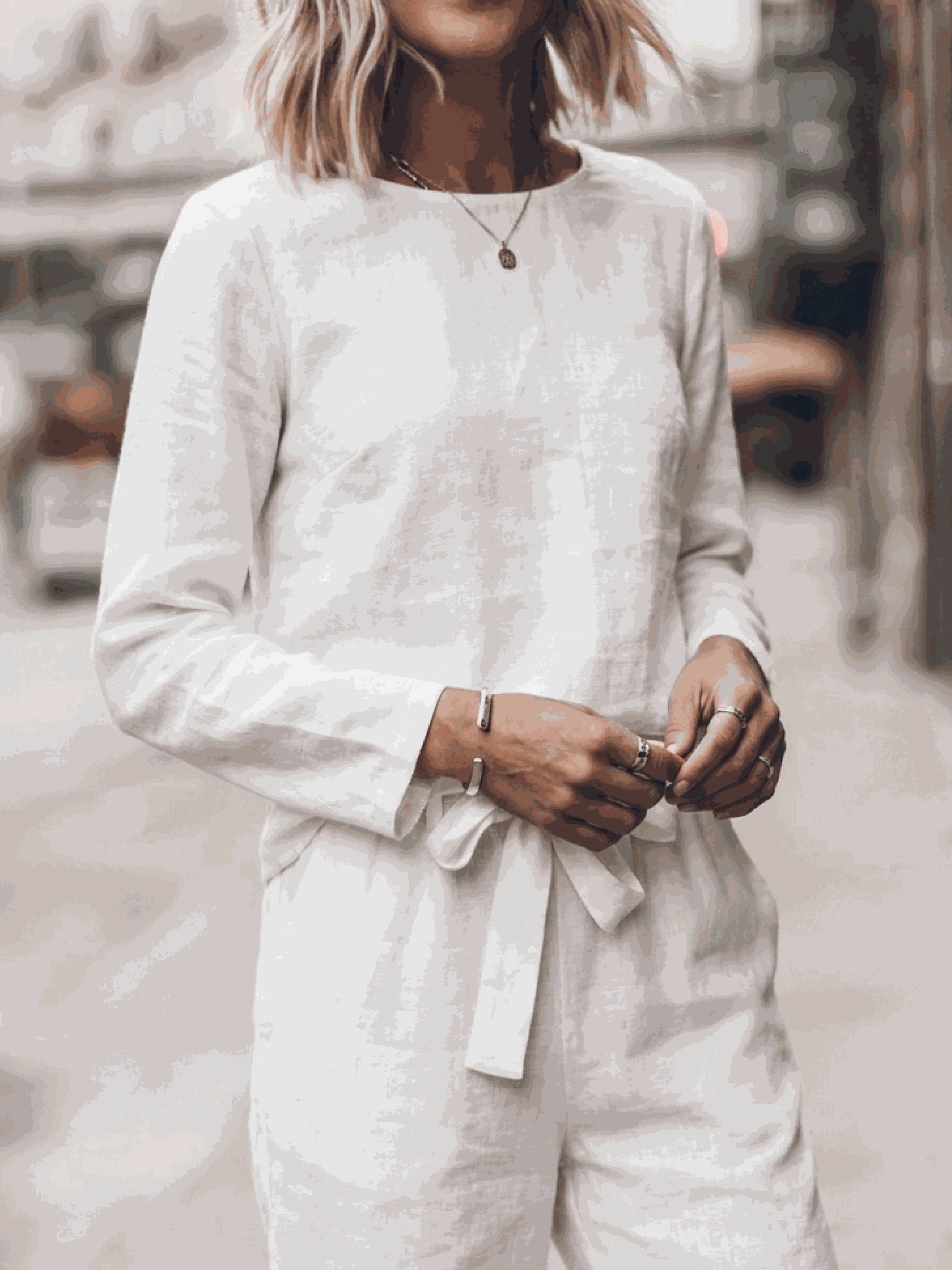 Women wearing relaxed cotton-linen set with short-sleeve top and straight-leg pants in neutral tones